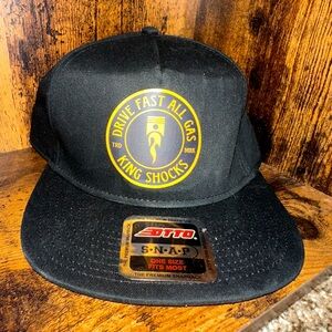 OTTO Black Snapback Hat with Yellow King Shocks Logo